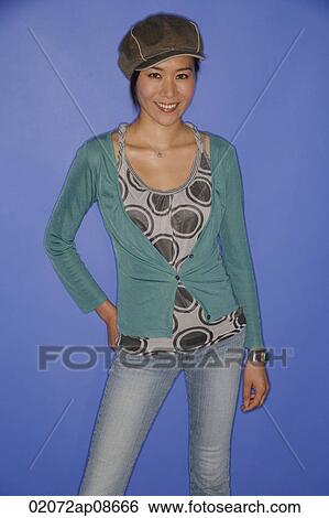 Young woman smiling at camera View Large Photo Image Stock Photograph - Young woman smiling at camera. Fotosearch