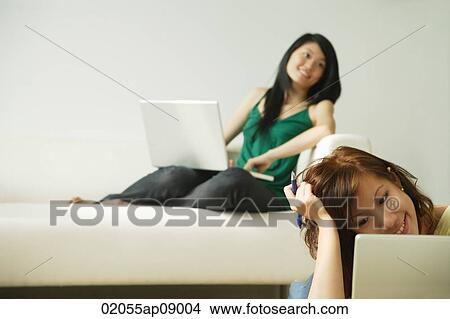 Young women using laptops View Large Photo Image Picture - Young women using laptops. Fotosearch