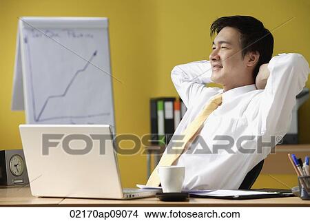 Picture - Businessman in office. Fotosearch
