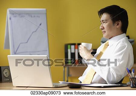 Businessman in office View Large Photo Image Stock Image - Businessman in office. Fotosearch