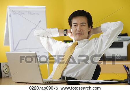 Businessman in office View Large Photo Image Stock Photography - Businessman in office. Fotosearch