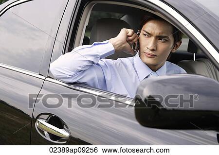 Businessman on mobile phone View Large Photo Image Stock Photograph - Businessman on mobile phone. Fotosearch