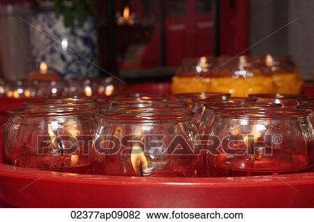Close up of candles at temple altar View Large Photo Image Stock Image - Close up of candles at temple altar. Fotosearch