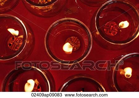 Close up of candles at temple altar View Large Photo Image Stock Image - Close up of candles at temple altar. Fotosearch
