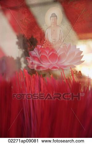 Close up of incense sticks and Buddha in lotus flower View Large Photo Image Stock Image - Close up of incense sticks and Buddha in lotus flower. Fotosearch