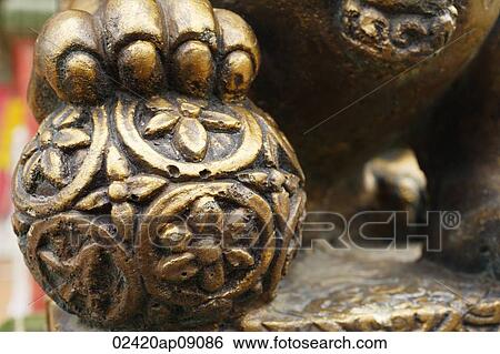 Close up of statue of lion's paw on orb View Large Photo Image Stock Photograph - Close up of statue of lion's paw on orb. Fotosearch