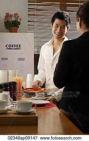 Colleagues chatting on coffee break View Large Photo Image Stock Photo - Colleagues chatting on coffee break. Fotosearch