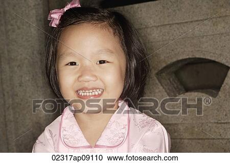 Little Chinese girl smiling View Large Photo Image Stock Image - Little Chinese girl smiling. Fotosearch