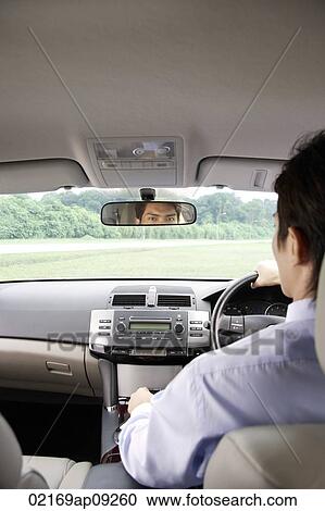 Stock Image - Man driving in car. Fotosearch