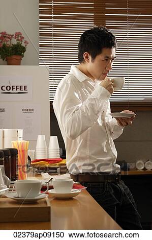 man enjoying coffee break View Large Photo Image Stock Image - man enjoying coffee break. Fotosearch