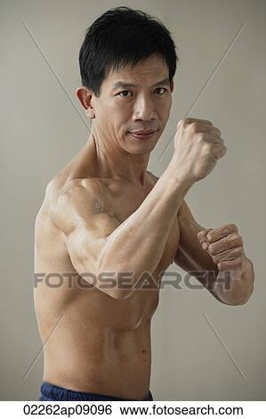 Man in martial arts pose View Large Photo Image Stock Photograph - Man in martial arts pose. Fotosearch
