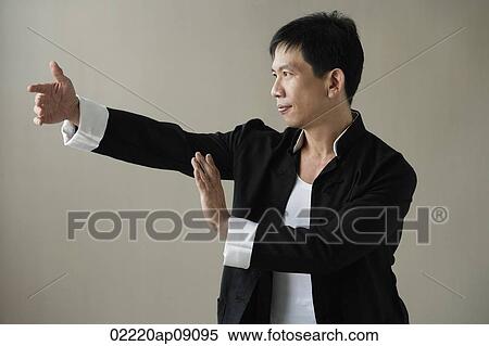Man in martial arts pose View Large Photo Image Stock Photography - Man in martial arts pose. Fotosearch