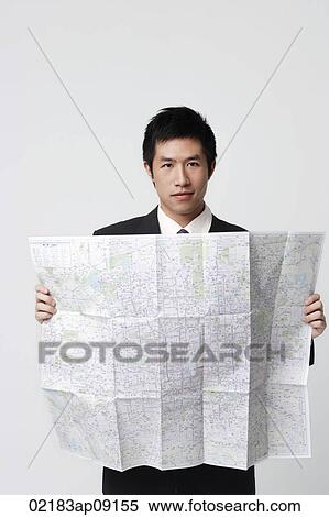 Stock Photography - Man with map. Fotosearch