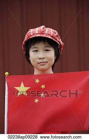 Portrait of little girl standing behind Chinese flag View Large Photo Image Stock Photo - Portrait of little girl standing behind Chinese flag. Fotosearch