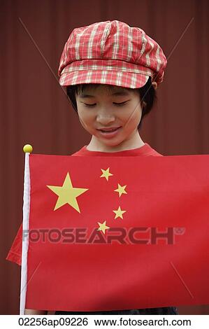 Portrait of little girl standing behind Chinese flag View Large Photo Image Stock Photograph - Portrait of little girl standing behind Chinese flag. Fotosearch