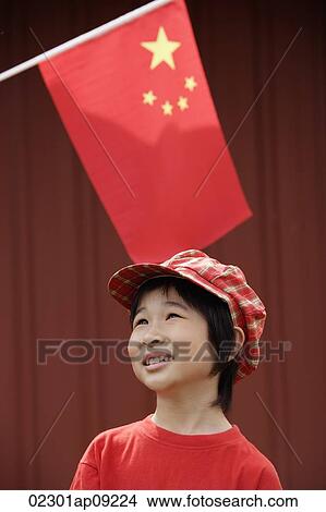 Portrait of little girl standing under Chinese flag View Large Photo Image Picture - Portrait of little girl standing under Chinese flag. Fotosearch