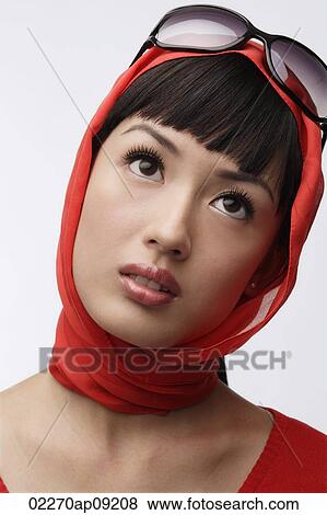 Portrait of woman wearing red sweater, scarf and sunglasses View Large Photo Image Stock Photo - Portrait of woman wearing red sweater, scarf and sunglasses. Fotosearch
