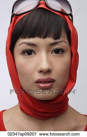 Portrait of woman wearing red sweater, scarf and sunglasses View Large Photo Image Stock Photo - Portrait of woman wearing red sweater, scarf and sunglasses. Fotosearch
