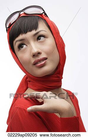 Portrait of woman wearing red sweater, scarf and sunglasses View Large Photo Image Stock Photography - Portrait of woman wearing red sweater, scarf and sunglasses. Fotosearch