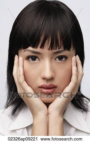Portrait of woman with hands on face View Large Photo Image Stock Image - Portrait of woman with hands on face. Fotosearch