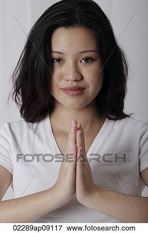 Pregnant woman standing in prayer posture View Large Photo Image Stock Photo - Pregnant woman standing in prayer posture. Fotosearch
