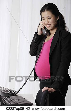 Profile of pregnant businesswoman on phone View Large Photo Image Stock Image - Profile of pregnant businesswoman on phone. Fotosearch