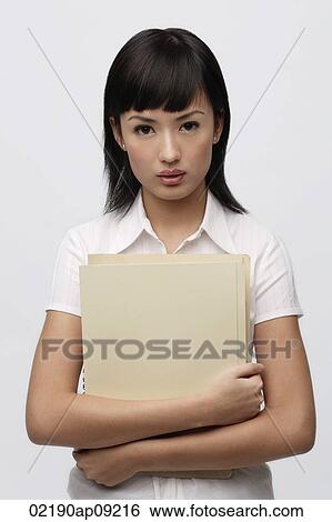 Stock Photograph - Secretary holding files. Fotosearch