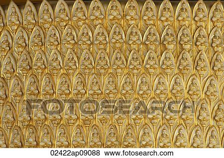 Structure covered with golden Buddhas sitting in lotus View Large Photo Image Stock Photo - Structure covered with golden Buddhas sitting in lotus. Fotosearch