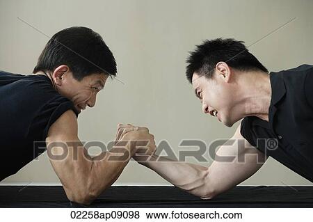 Two men arm wrestling View Large Photo Image Stock Photo - Two men arm wrestling. Fotosearch