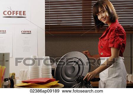 Waitress in diner taking out trash View Large Photo Image Stock Photo - Waitress in diner taking out trash. Fotosearch