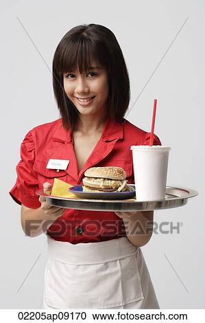 Waitress serving meal View Large Photo Image Stock Image - Waitress serving meal. Fotosearch