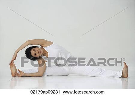 Woman in practicing yoga View Large Photo Image Stock Image - Woman in practicing yoga. Fotosearch