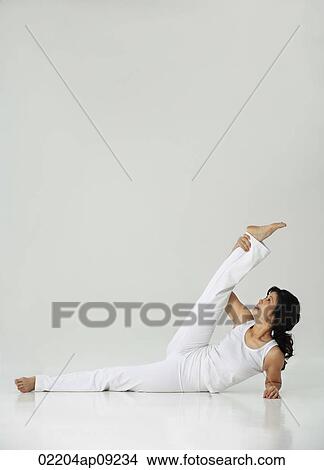 Picture - Woman practicing yoga. Fotosearch