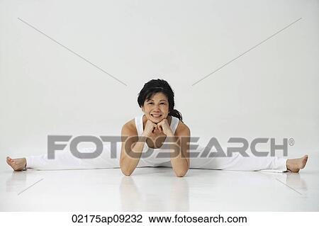 Woman practicing yoga View Large Photo Image Stock Image - Woman practicing yoga. Fotosearch