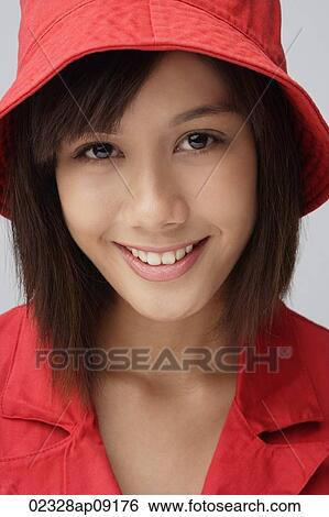 Young woman in red hat View Large Photo Image Stock Photograph - Young woman in red hat. Fotosearch