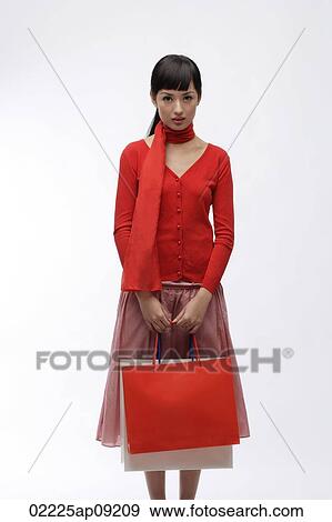 Young woman with shopping bags View Large Photo Image Stock Photo - Young woman with shopping bags. Fotosearch