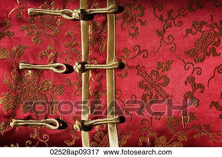 Stock Photo - Detail of buttons on silk Chinese shirt. Fotosearch