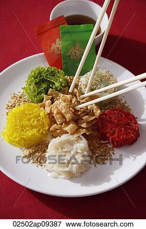 Plate of raw fish salad also known as "Yu Sheng" or "Lo Hei" View Large Photo Image Stock Photo - Plate of raw fish salad also known as "Yu Sheng" or "Lo Hei". Fotosearch
