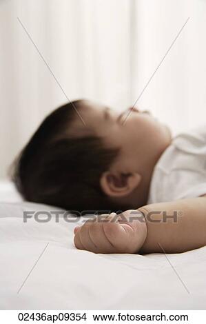 Picture - profile of sleeping baby. Fotosearch