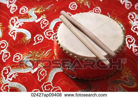 Still life of Chinese drum on Chinese silk fabric View Large Photo Image Stock Photo - Still life of Chinese drum on Chinese silk fabric. Fotosearch