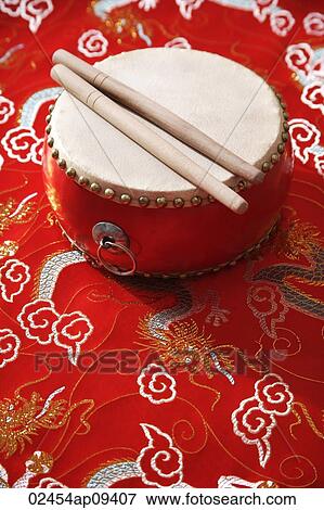 Still life of Chinese drum on Chinese silk fabric View Large Photo Image Stock Photo - Still life of Chinese drum on Chinese silk fabric. Fotosearch