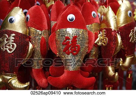 Still life of hanging decorations of fish with Chinese character for "fortune" View Large Photo Image Stock Image - Still life of hanging decorations of fish with Chinese character for "fortune". Fotosearch