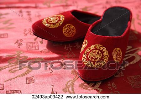 Still life of pair of red shoes on oriental design fabric View Large Photo Image Stock Image - Still life of pair of red shoes on oriental design fabric. Fotosearch