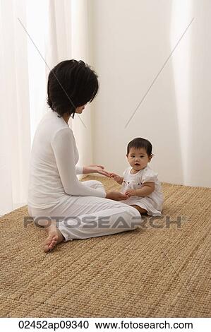 Woman with baby View Large Photo Image Stock Image - Woman with baby. Fotosearch