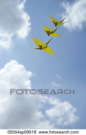 3 yellow paper cranes against sky backdrop View Large Photo Image Stock Photo - 3 yellow paper cranes against sky backdrop. Fotosearch