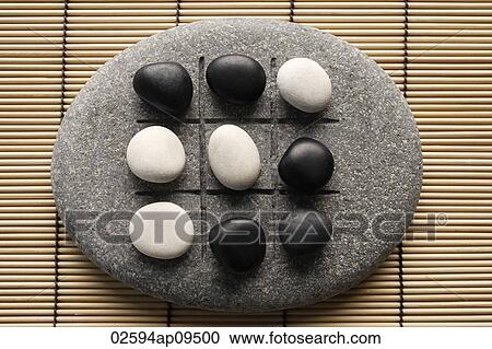 black and white pebbles on zen stone View Large Photo Image Stock Image - black and white pebbles on zen stone. Fotosearch