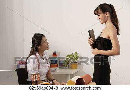Caucasian model holding file in hand for Chinese fashion designer View Large Photo Image Stock Photo - Caucasian model holding file in hand for Chinese fashion designer. Fotosearch
