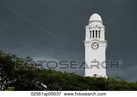 Clock tower against dark skies View Large Photo Image Stock Photo - Clock tower against dark skies. Fotosearch