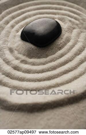 closeup of zen garden pebble detail on raked sand View Large Photo Image Stock Photo - closeup of zen garden pebble detail on raked sand. Fotosearch