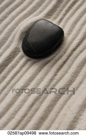 closeup of zen garden pebble detail on raked sand View Large Photo Image Stock Photo - closeup of zen garden pebble detail on raked sand. Fotosearch